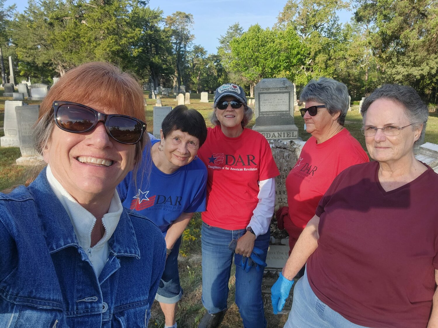 DAR members, from left, Chapter Regent Jenniffer Hudson-Connors, Vera Spencer, Brenda Martinez, Linda Haddock and Nancy Bailey at the Mineola City Cemetery.